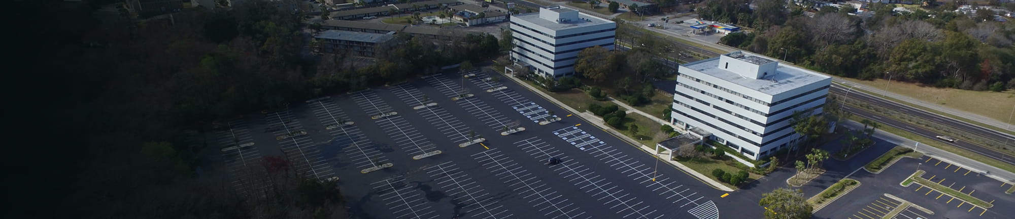 Large parking lot and office building
