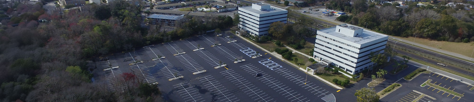 Large parking lot and office building